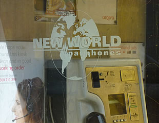 New World Payphones logo on payphone window